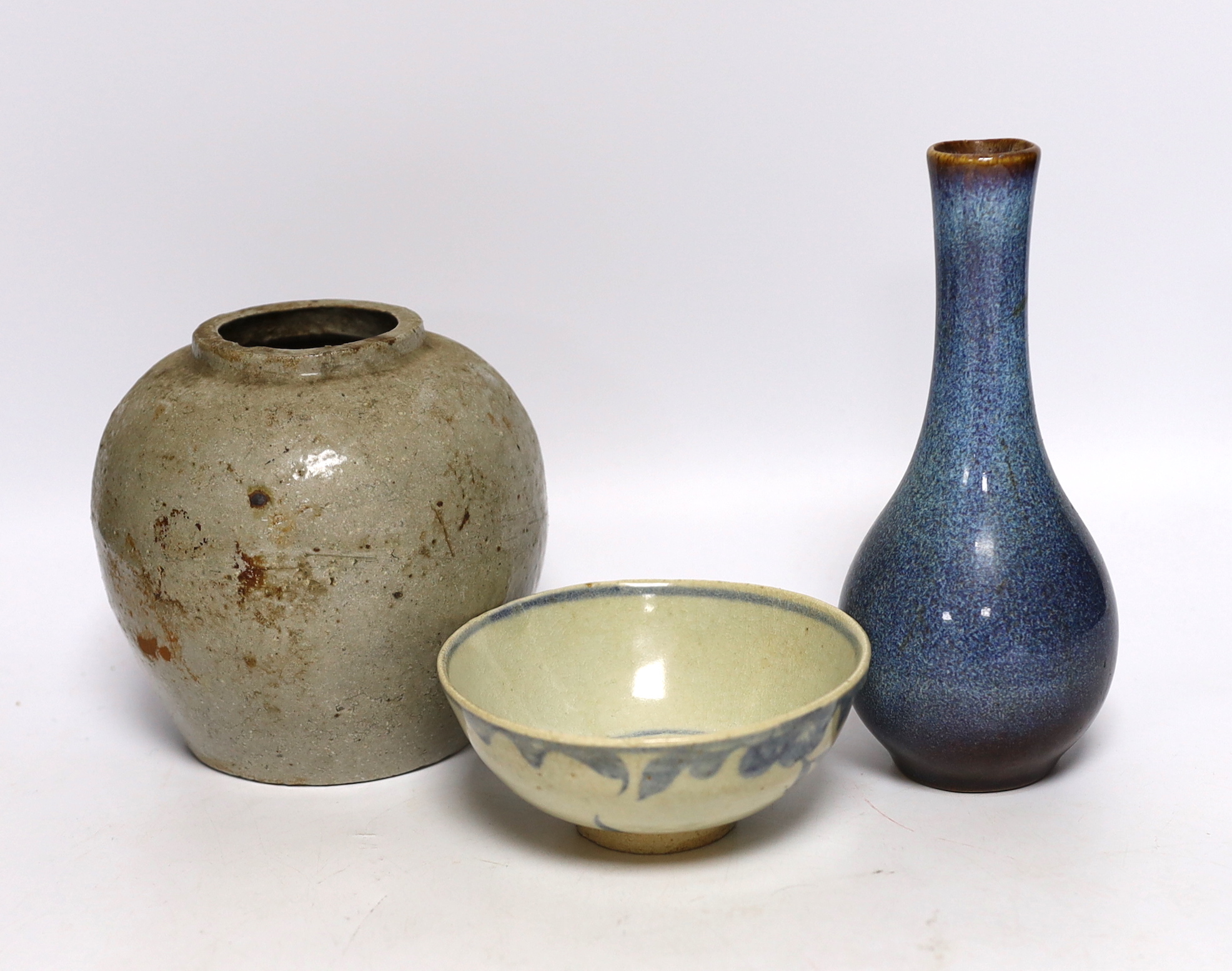 A Chinese Shiwan vase, a jar and a blue and white bowl, largest 18cm high